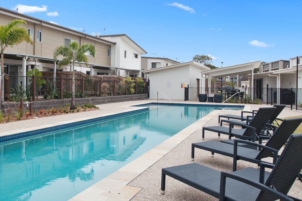 apartment building with large pool part of fundrise project