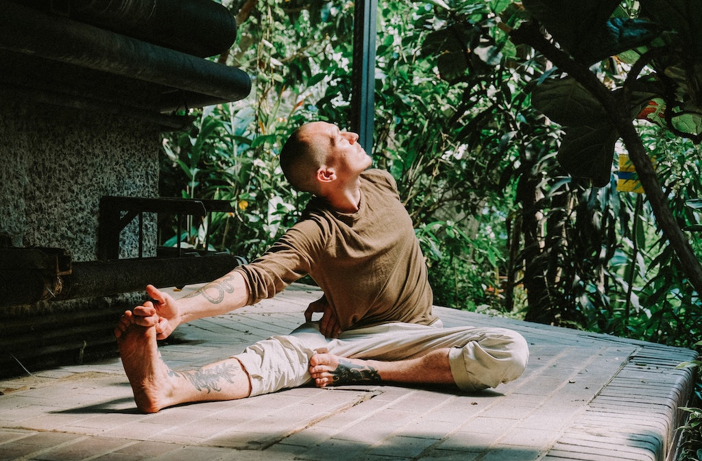 man learning how to stretch himself and his budget